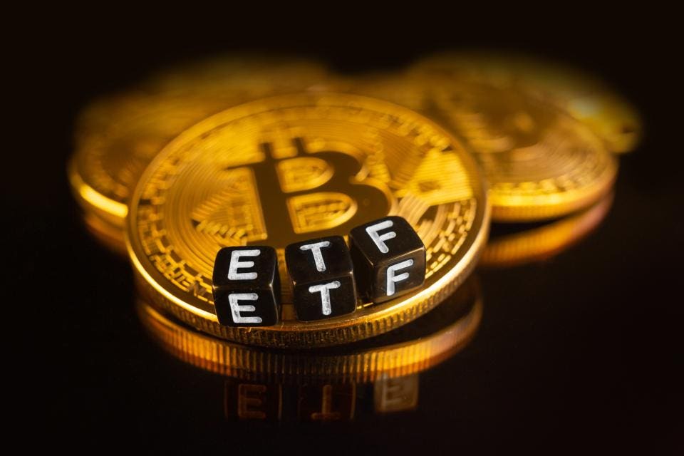 US bitcoin ETFs see $ billion in volume in first day of trading | Reuters