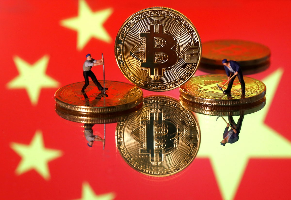 Bruised by stock market, China rushes into banned bitcoin - The Japan Times